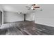 Expansive living area with neutral walls, tile flooring, and comfortable ceiling fans at 4714 Kemble Ct, Tampa, FL 33624