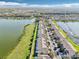 Aerial view of townhomes backing up to a scenic lake, offering a peaceful and serene setting at 4806 Pond Ridge Dr, Riverview, FL 33578