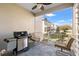 Relaxing balcony with an outdoor grill and seating overlooking a residential neighborhood at 4859 W Prescott St, Tampa, FL 33616