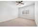 Bedroom featuring neutral walls and carpet with a large window for natural light at 4859 W Prescott St, Tampa, FL 33616