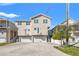 A charming, multi-level house with a two-car garage, balcony, and well-maintained landscaping, perfect for comfortable living at 4859 W Prescott St, Tampa, FL 33616