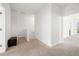 Bright hallway featuring neutral carpet, white walls, and an elegant transition to the upper level at 4859 W Prescott St, Tampa, FL 33616