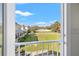 A beautiful view from the balcony overlooking the manicured lawn and surrounding neighborhood at 4859 W Prescott St, Tampa, FL 33616