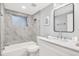 Modern bathroom featuring a tub-shower combination and a sleek vanity at 5200 Dove Dr, New Port Richey, FL 34652
