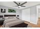 Neutral bedroom with a ceiling fan, a comfortable bed, and a built-in closet at 5200 Dove Dr, New Port Richey, FL 34652