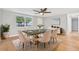 Elegant dining room features a marble-top table, modern chandelier, and neutral walls at 5200 Dove Dr, New Port Richey, FL 34652