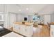 Bright open-concept living space featuring wood floors and a kitchen island with butcher block countertop at 5200 Dove Dr, New Port Richey, FL 34652