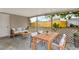 Relaxing covered patio, offering comfortable seating and a view of the fenced backyard at 5200 Dove Dr, New Port Richey, FL 34652