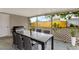 Spacious covered patio features a grill, a dining table, and a fenced yard at 5200 Dove Dr, New Port Richey, FL 34652