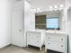 Bright bathroom featuring double vanities, large mirror, and modern fixtures at 5351 Lookout Pass, Wesley Chapel, FL 33544