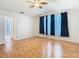 Large bedroom features a ceiling fan, wood floors, and a walk-in closet at 5351 Lookout Pass, Wesley Chapel, FL 33544
