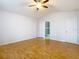 Spacious bedroom with vaulted ceiling, ceiling fan, and shiny hardwood floors; bathroom access at 5351 Lookout Pass, Wesley Chapel, FL 33544