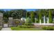 Stone entrance to Lexington Oaks featuring beautiful landscaping and a fountain at 5351 Lookout Pass, Wesley Chapel, FL 33544