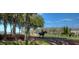 Scenic view of horse and rider on tree-lined track with vibrant landscaping and well-maintained grounds in community at 5351 Lookout Pass, Wesley Chapel, FL 33544