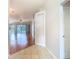 Open-concept living space with hardwood floors and sliding glass doors to the patio at 5351 Lookout Pass, Wesley Chapel, FL 33544