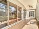 Relaxing tiled patio with ceiling fans overlooks the backyard and beyond at 5351 Lookout Pass, Wesley Chapel, FL 33544