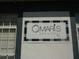 Close-up of the O'Maris Bar & Grill sign, a local restaurant with outdoor seating near Lexington Oaks at 5351 Lookout Pass, Wesley Chapel, FL 33544