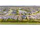 Beautiful aerial view of single-Gathering homes in a well-maintained community with a lake and green spaces at 5647 Del Coronado Dr, Apollo Beach, FL 33572
