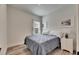 Bedroom with wood-look floors, modern decor and a sunny window at 5647 Del Coronado Dr, Apollo Beach, FL 33572