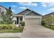 Charming single-Gathering home with a well-maintained lawn, landscaping, and a two-car garage at 5647 Del Coronado Dr, Apollo Beach, FL 33572
