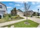 Attractive home with a two-car garage and a beautifully landscaped front yard and sidewalk at 5647 Del Coronado Dr, Apollo Beach, FL 33572