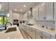 Modern kitchen with white cabinetry, stainless steel appliances, and ample counter space for food preparation at 5647 Del Coronado Dr, Apollo Beach, FL 33572