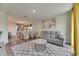 Spacious living area with an open floor plan, modern decor, and lots of natural light at 5647 Del Coronado Dr, Apollo Beach, FL 33572