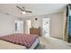 Bedroom featuring a ceiling fan and ensuite bathroom at 6228 Dutton Dr, Wesley Chapel, FL 33545