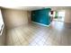 Bright and airy living room with tile flooring, perfect for entertaining at 6926 Echo Lake Dr, New Port Richey, FL 34653