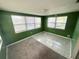 Versatile bonus room featuring ample natural light and an additional area for various activities at 6926 Echo Lake Dr, New Port Richey, FL 34653