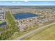 Stunning aerial view of a home in a lakeside community, offering picturesque surroundings at 707 Fern Leaf Dr, Ruskin, FL 33570