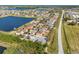 Aerial view showcases this home nestled in a lakeside community at 707 Fern Leaf Dr, Ruskin, FL 33570