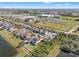 Beautiful aerial view of a residential area with a neighborhood pond and green spaces at 707 Fern Leaf Dr, Ruskin, FL 33570