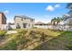 Large backyard features a fence and a grassy space at 707 Fern Leaf Dr, Ruskin, FL 33570