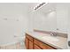 Bathroom features a tile floor, and a well-lit mirror at 707 Fern Leaf Dr, Ruskin, FL 33570