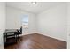 Bedroom complete with wood floors, natural light, and ample space at 707 Fern Leaf Dr, Ruskin, FL 33570