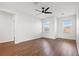The bedroom boasts beautiful wood flooring and a modern ceiling fan to keep you cool and comfortable at 707 Fern Leaf Dr, Ruskin, FL 33570