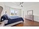 Well-lit primary bedroom features wood floors and an expansive closet for optimal storage at 707 Fern Leaf Dr, Ruskin, FL 33570