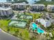 Nice aerial view of the pool and tennis courts next to the condominium at 7194 Key Haven Rd # 405, Seminole, FL 33777