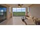 Spacious screened balcony with comfortable seating and scenic views of the surrounding landscape at 7194 Key Haven Rd # 405, Seminole, FL 33777