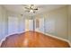 Spacious bedroom features gleaming hardwood floors, ample closet space, and neutral paint at 7194 Key Haven Rd # 405, Seminole, FL 33777