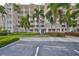 View of the building from the parking lot at 7194 Key Haven Rd # 405, Seminole, FL 33777