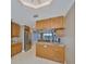 Well-designed kitchen with stainless steel appliances, granite counters, and natural light at 7194 Key Haven Rd # 405, Seminole, FL 33777