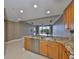 Spacious kitchen features granite countertops and stainless steel dishwasher with an open design at 7194 Key Haven Rd # 405, Seminole, FL 33777