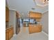 Contemporary kitchen featuring stainless appliances, granite countertops, and lots of light at 7194 Key Haven Rd # 405, Seminole, FL 33777