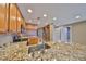 Gourmet kitchen featuring granite countertops, stainless steel appliances, and ample cabinet space at 7194 Key Haven Rd # 405, Seminole, FL 33777