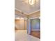 Neutral living room with ceramic tile flooring, modern lighting, and an airy feel at 7194 Key Haven Rd # 405, Seminole, FL 33777