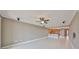 Spacious living room with tile flooring and an open layout to the kitchen with bar seating at 7194 Key Haven Rd # 405, Seminole, FL 33777