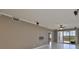Neutral-toned living room featuring a ceiling fan, balcony access, and recessed lighting at 7194 Key Haven Rd # 405, Seminole, FL 33777