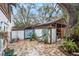 Backyard area with art design, brick pavers and decorative plants at 799 Fairwood Ln, Clearwater, FL 33759